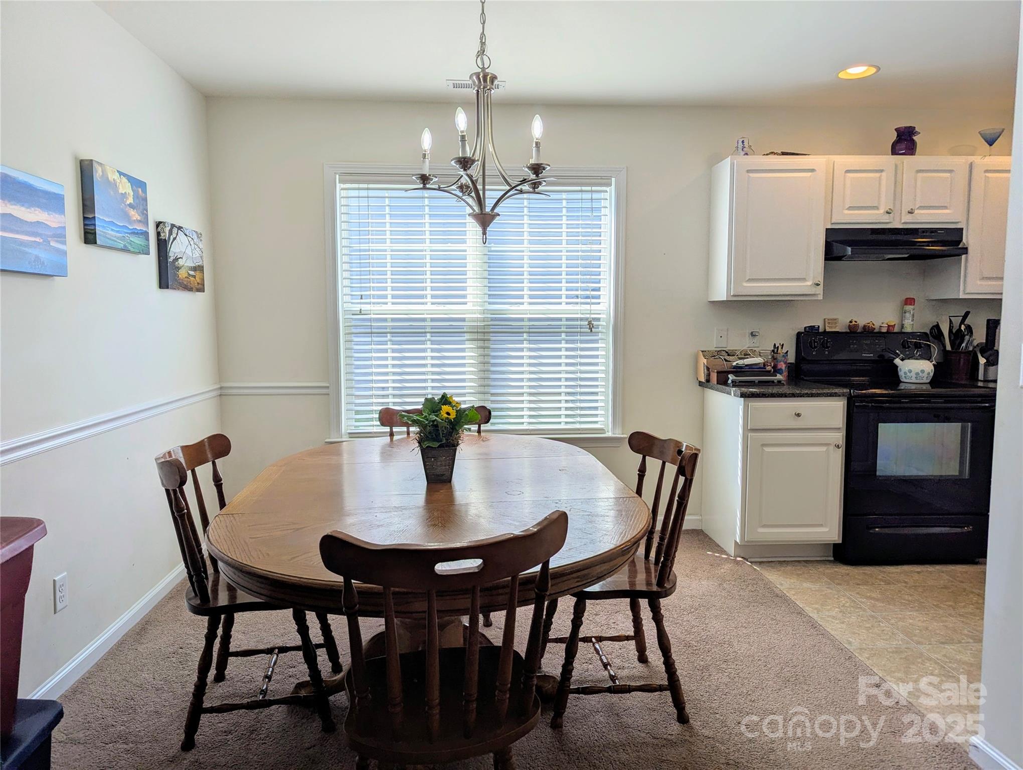 163 West Swift Creek Road Fletcher, NC 28732 - Photo 7 of 26 a view of a dining room with furniture and wooden floor