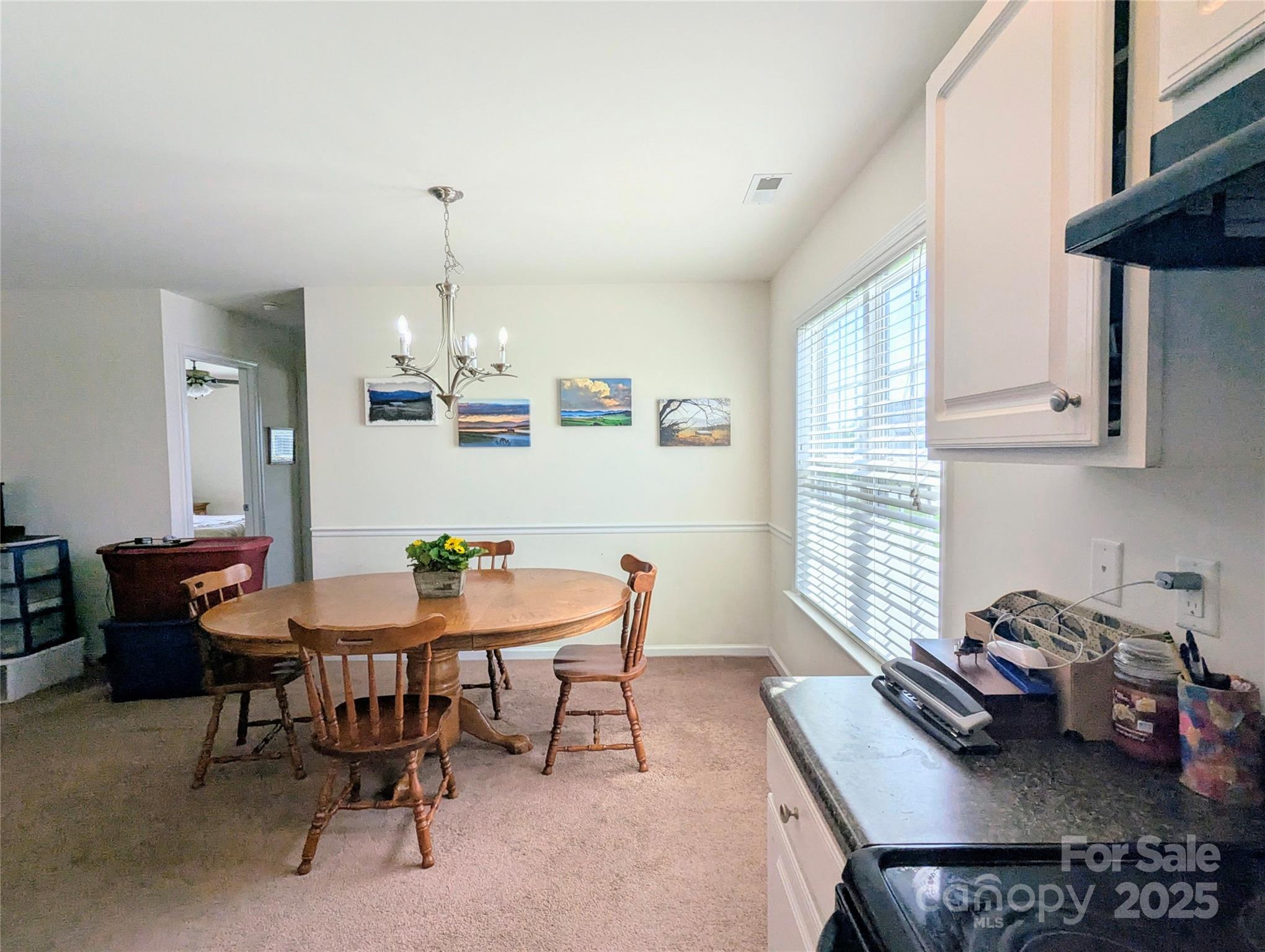 163 West Swift Creek Road Fletcher, NC 28732 - Photo 9 of 26 a view of a dining room with furniture and chandelier