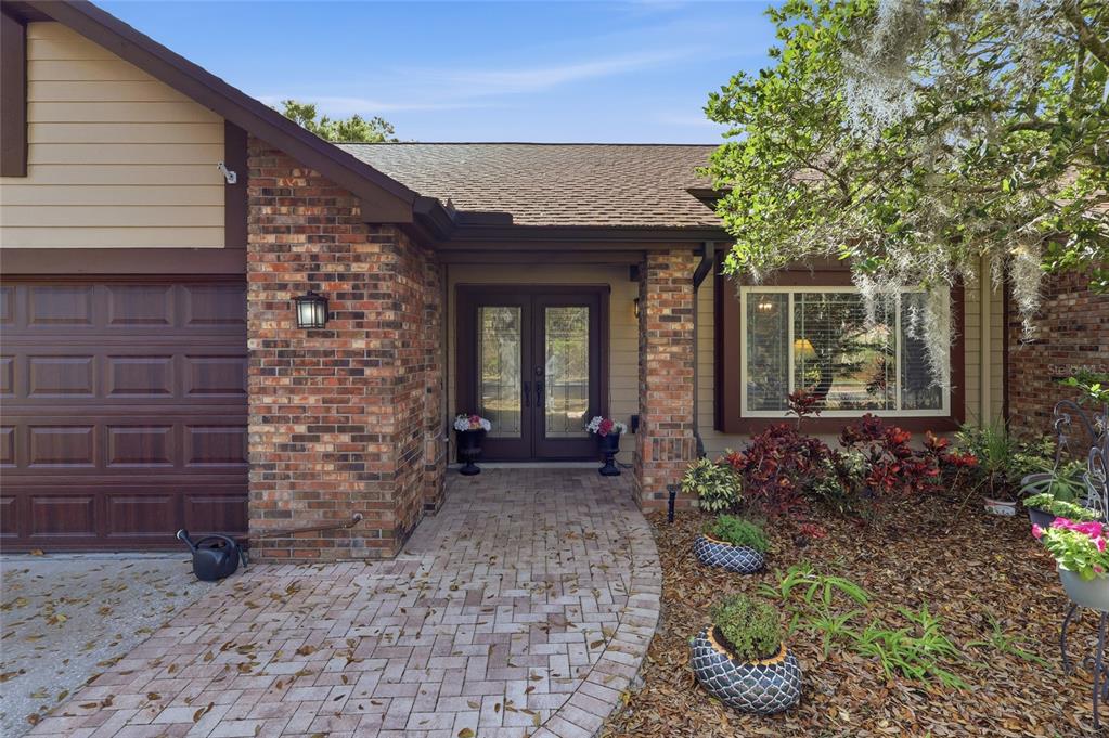 3488 Ridge Boulevard Palm Harbor, FL 34684 - Photo 2 of 30 a front view of a house with a garden