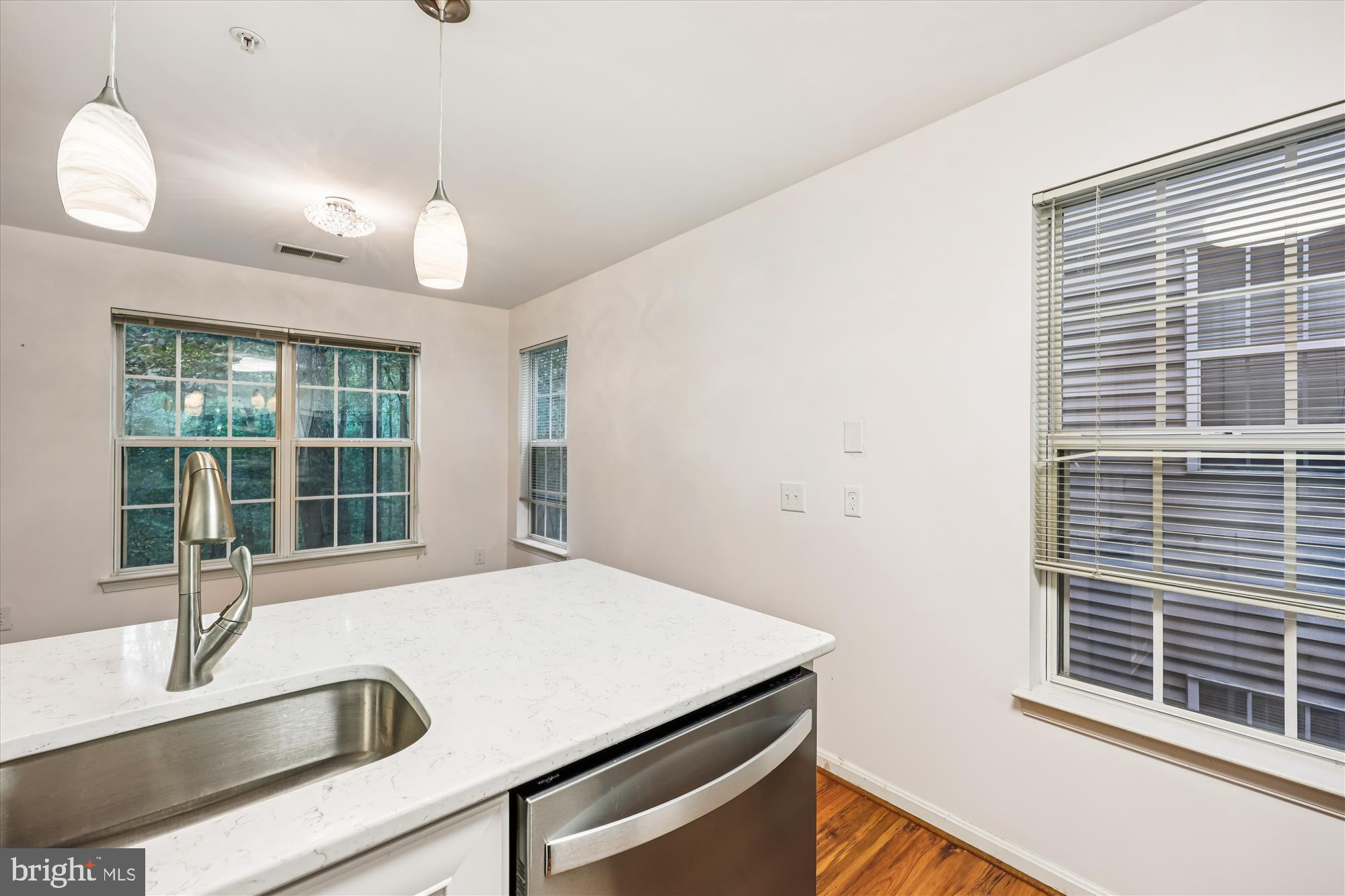 137 Timberbrook Lane, Unit 103 Gaithersburg, MD 20878 - Photo 12 of 51 a view of a kitchen with a sink and large window