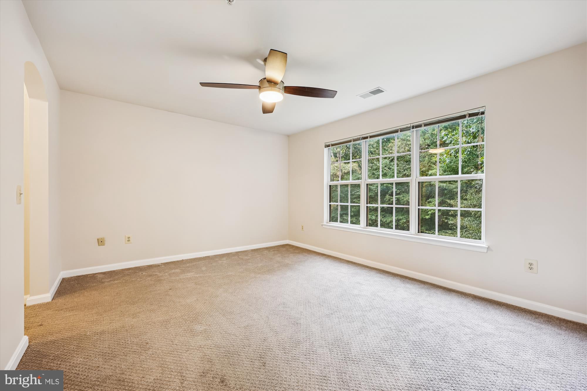 137 Timberbrook Lane, Unit 103 Gaithersburg, MD 20878 - Photo 15 of 51 a view of an empty room with a window