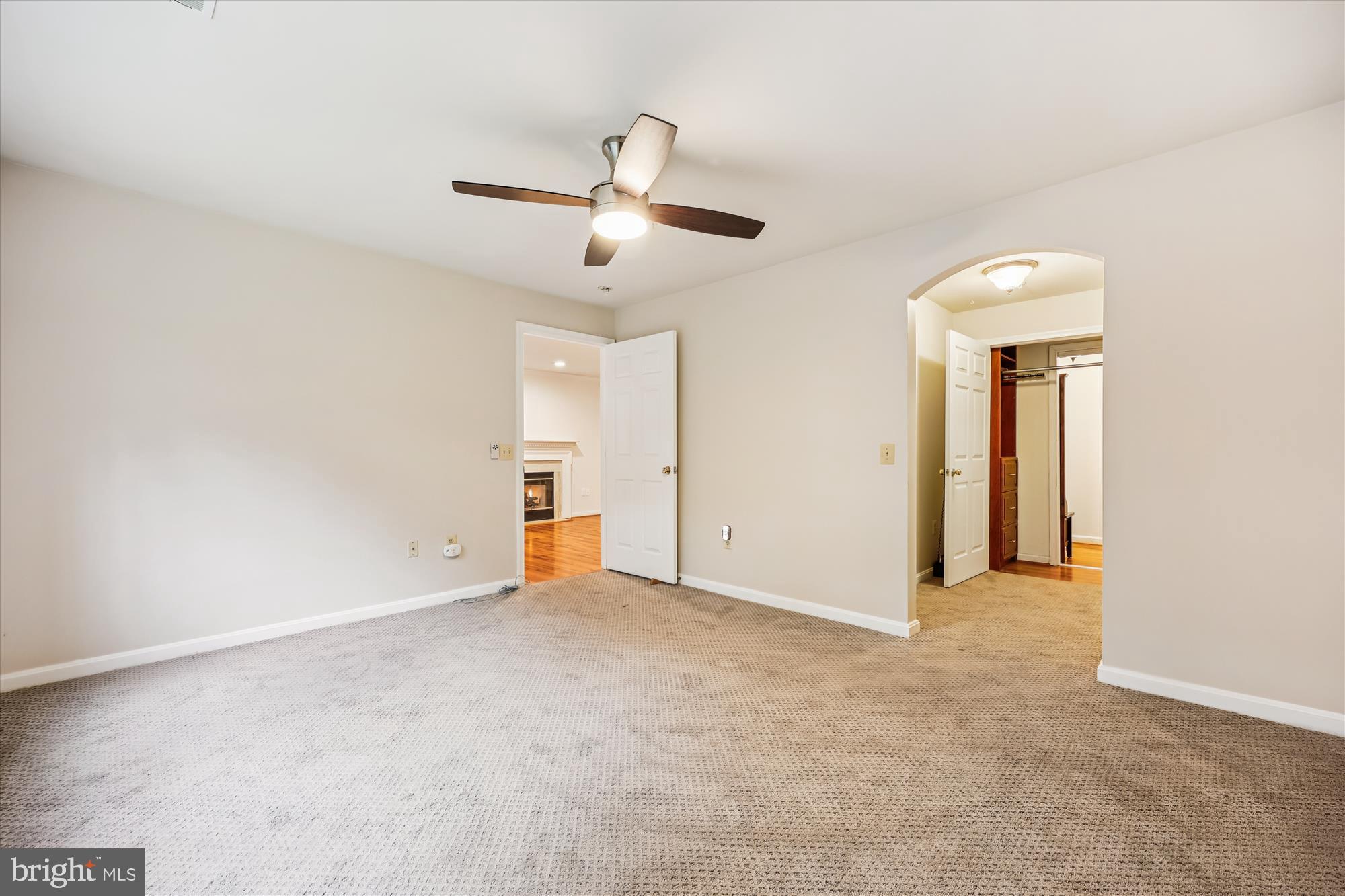 137 Timberbrook Lane, Unit 103 Gaithersburg, MD 20878 - Photo 16 of 51 an empty room with ceiling fan and window