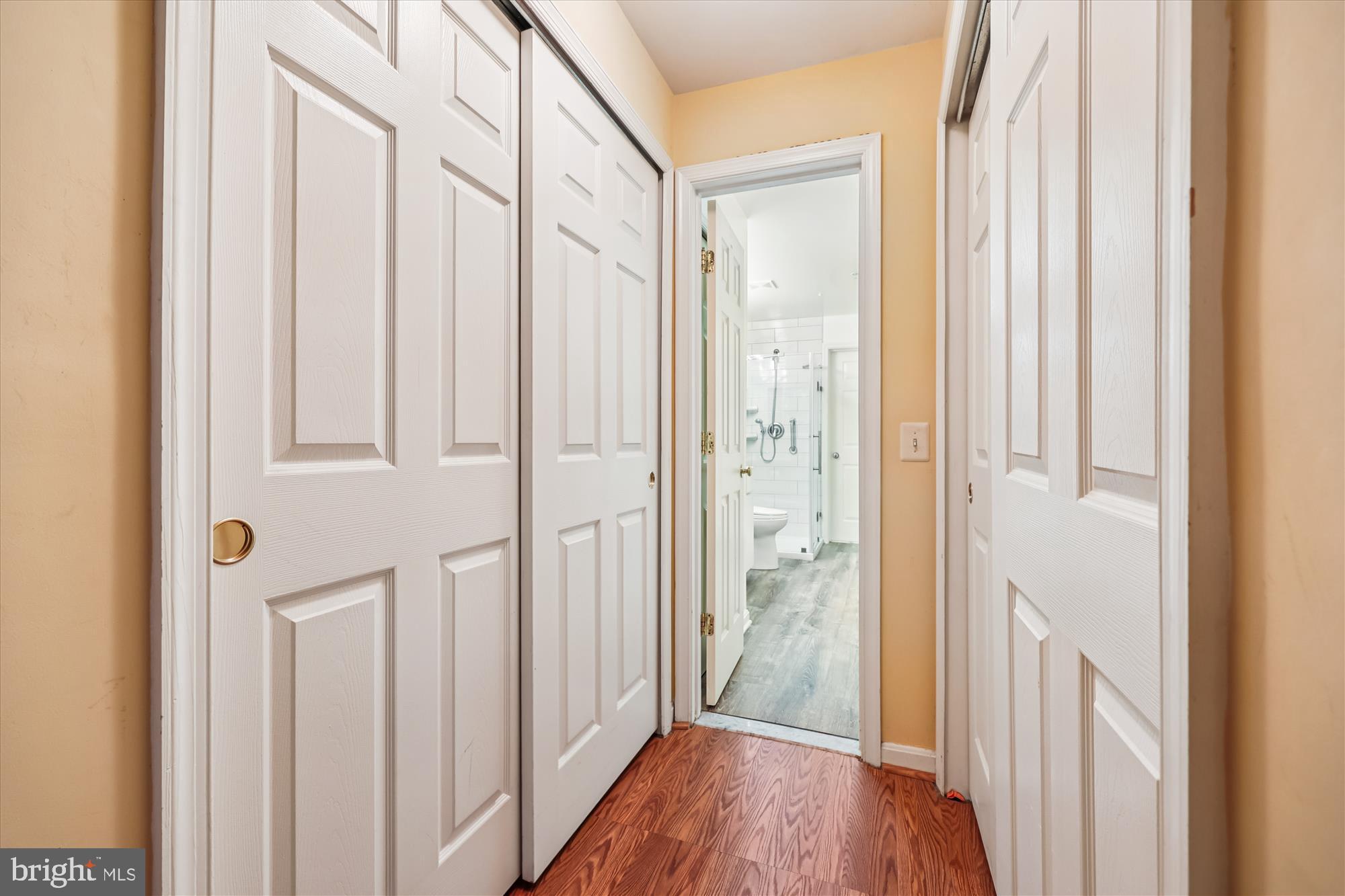 137 Timberbrook Lane, Unit 103 Gaithersburg, MD 20878 - Photo 21 of 51 a view of a hallway with wooden floor and entryway