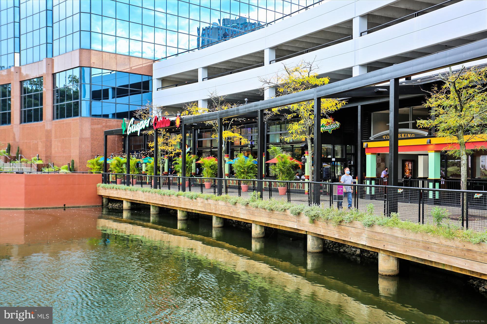 137 Timberbrook Lane, Unit 103 Gaithersburg, MD 20878 - Photo 41 of 51 a view of a swimming pool with a outdoor seating