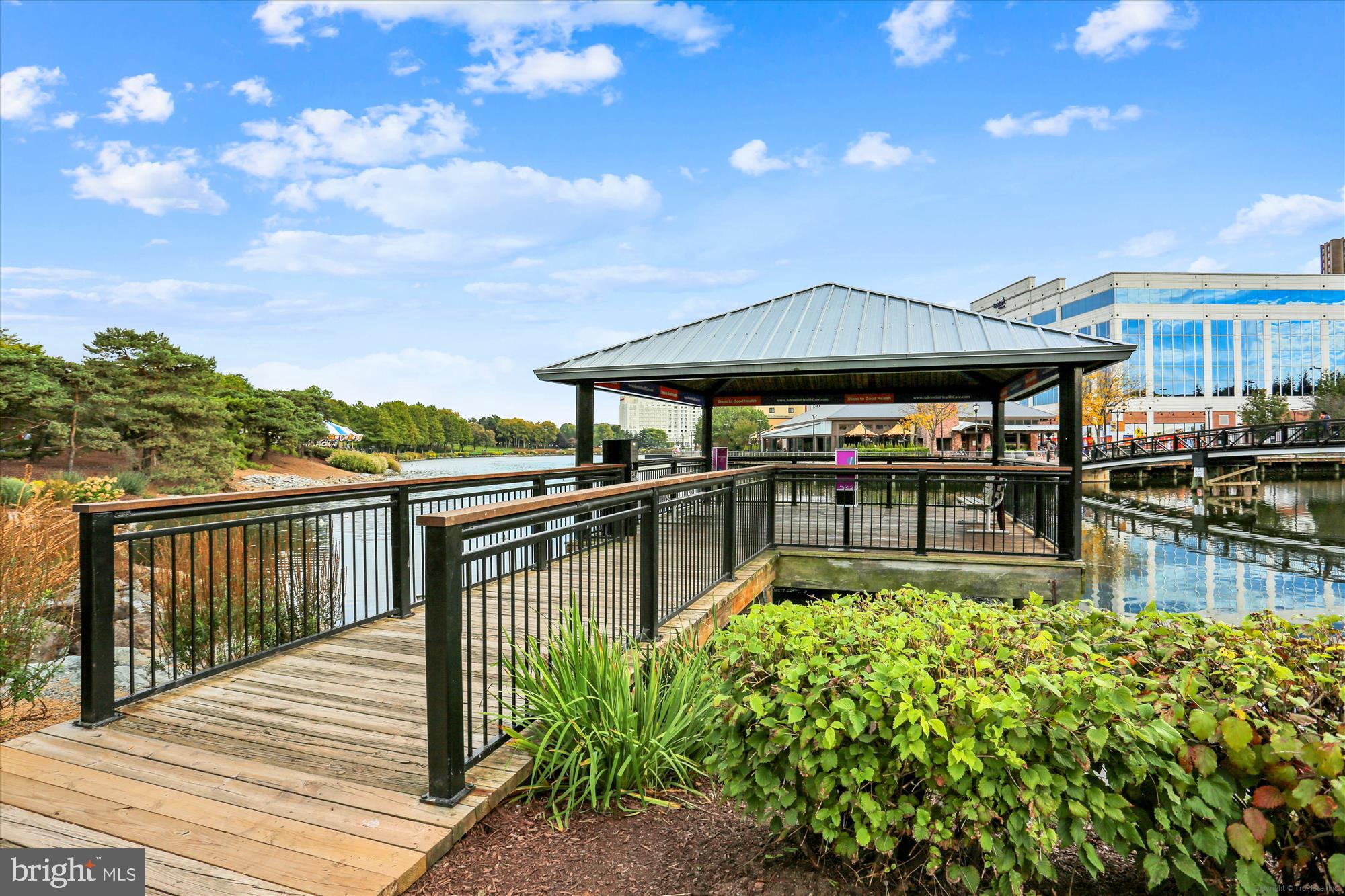 137 Timberbrook Lane, Unit 103 Gaithersburg, MD 20878 - Photo 45 of 51 a balcony with furniture and a table