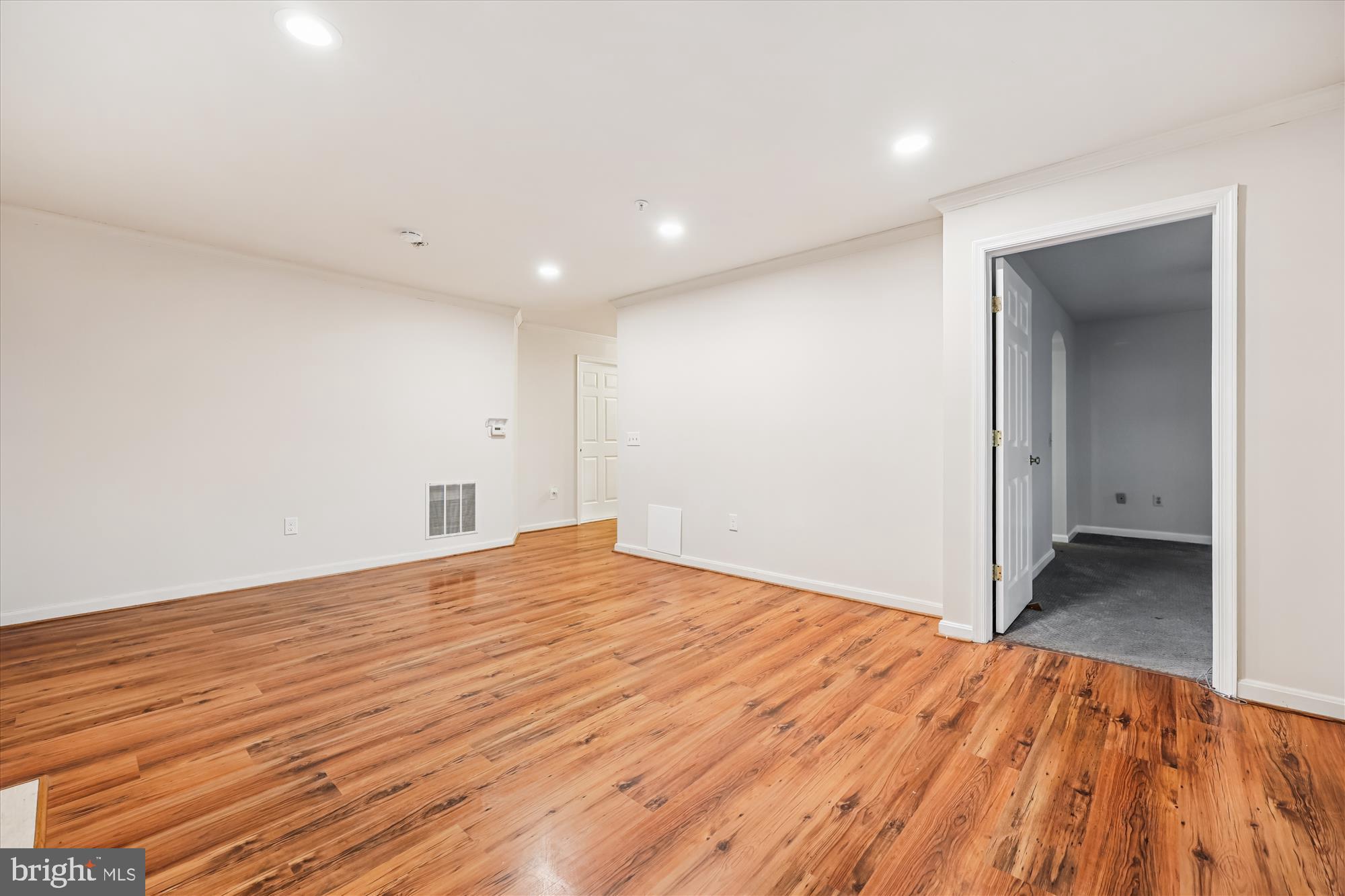 137 Timberbrook Lane, Unit 103 Gaithersburg, MD 20878 - Photo 6 of 51 a view of empty room with wooden floor