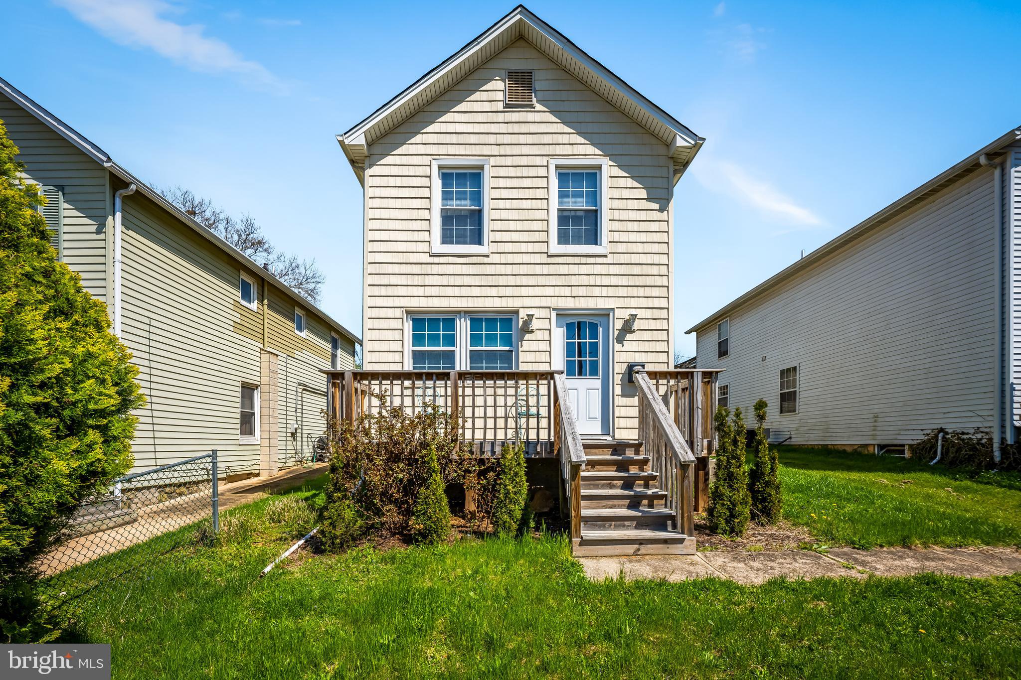 6045 Falls Road Baltimore, MD 21209 - Photo 2 of 32 a front view of a house with a yard