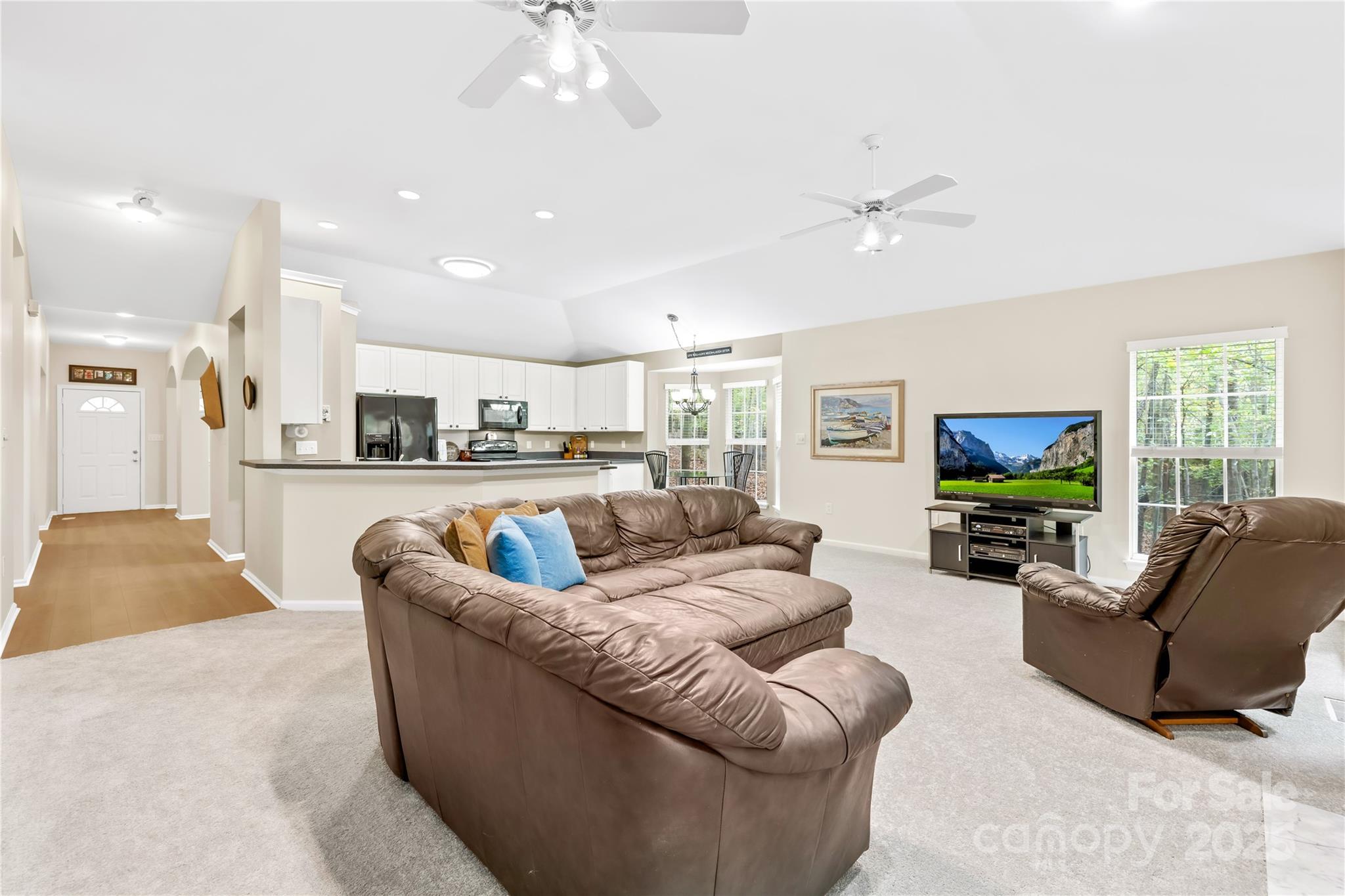 11113 Asbury Chapel Road Huntersville, NC 28078 - Photo 16 of 40 a living room with furniture and a flat screen tv
