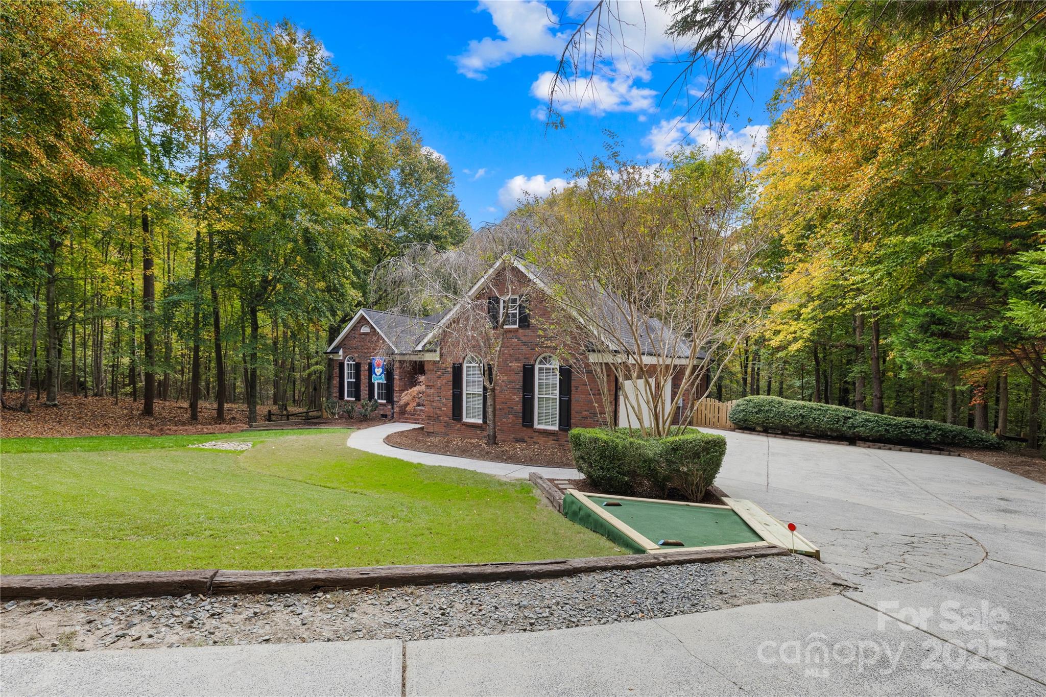 11113 Asbury Chapel Road Huntersville, NC 28078 - Photo 35 of 40 a front view of a house with a yard and garage
