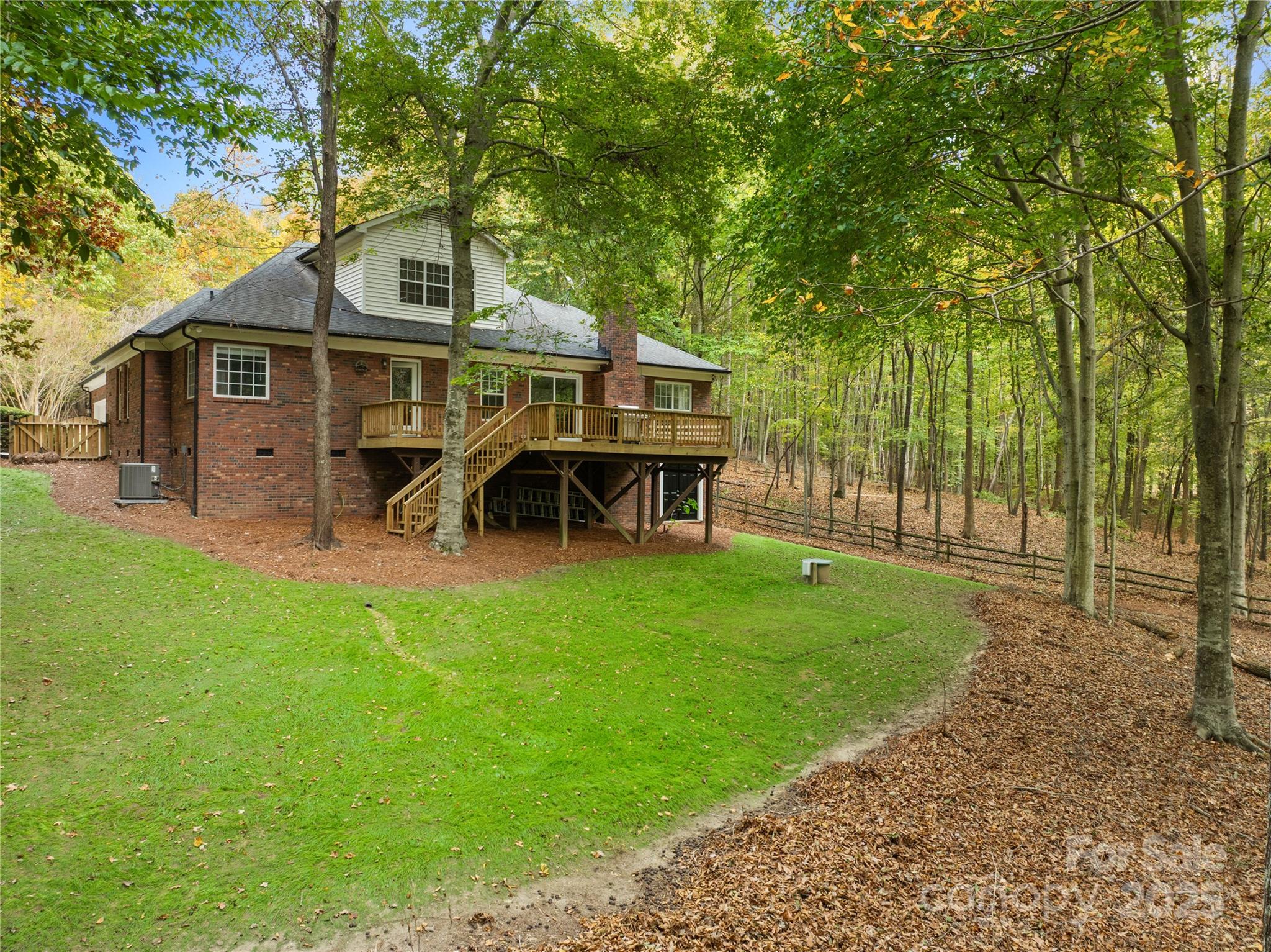 11113 Asbury Chapel Road Huntersville, NC 28078 - Photo 36 of 40 a view of a house with a yard porch and sitting area