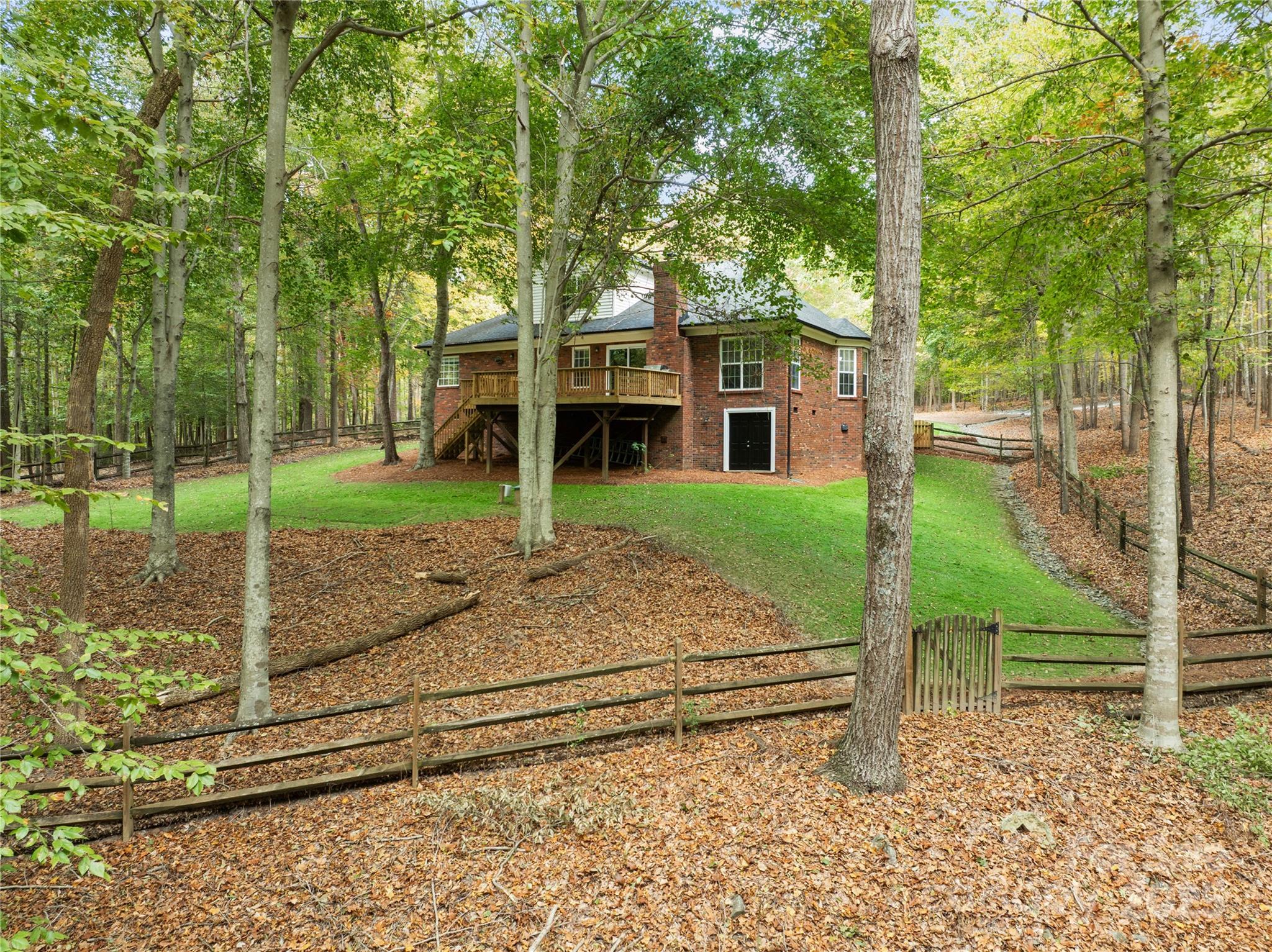 11113 Asbury Chapel Road Huntersville, NC 28078 - Photo 4 of 40 a view of a house with a yard and large tree