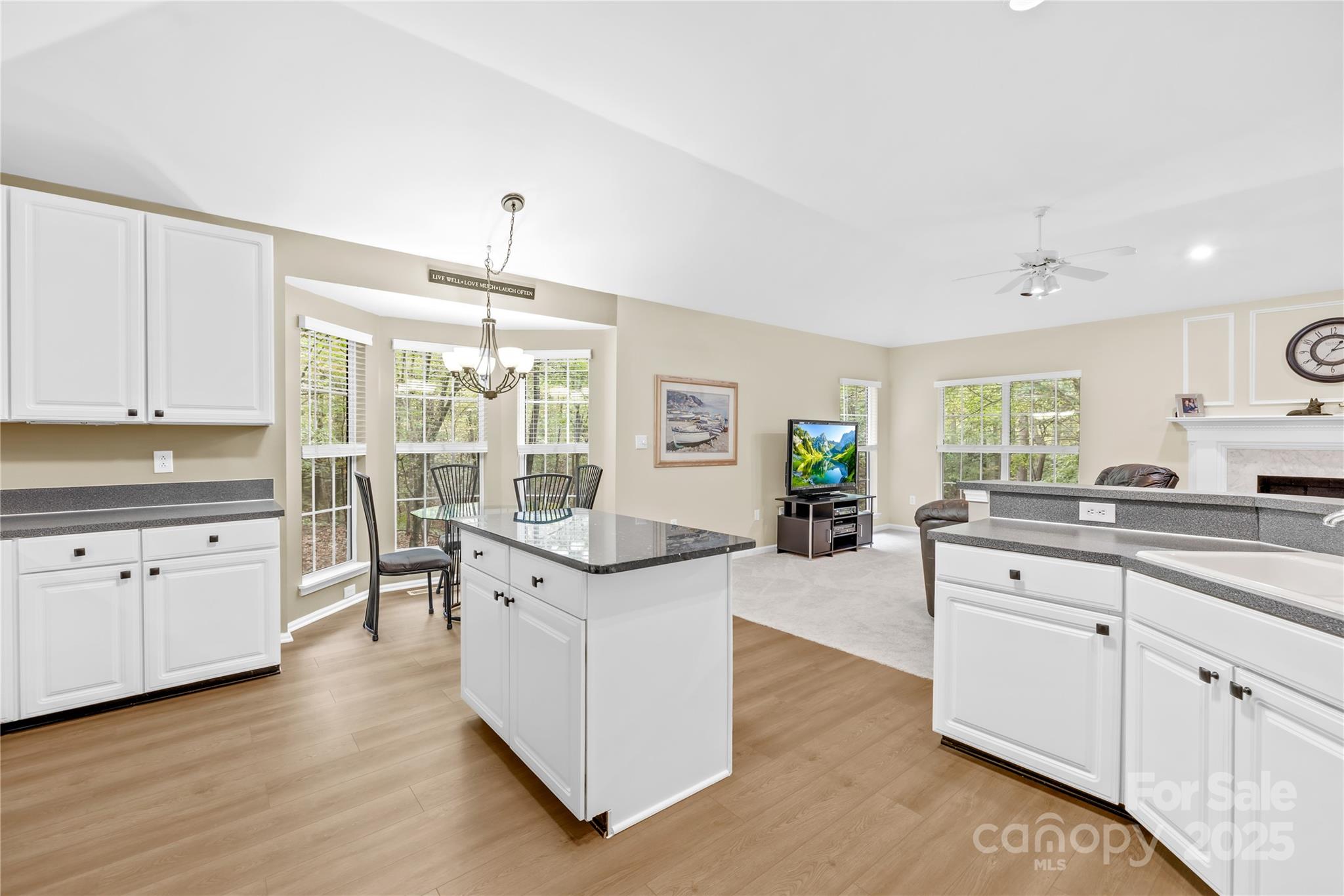 11113 Asbury Chapel Road Huntersville, NC 28078 - Photo 10 of 40 a large white kitchen with cabinets