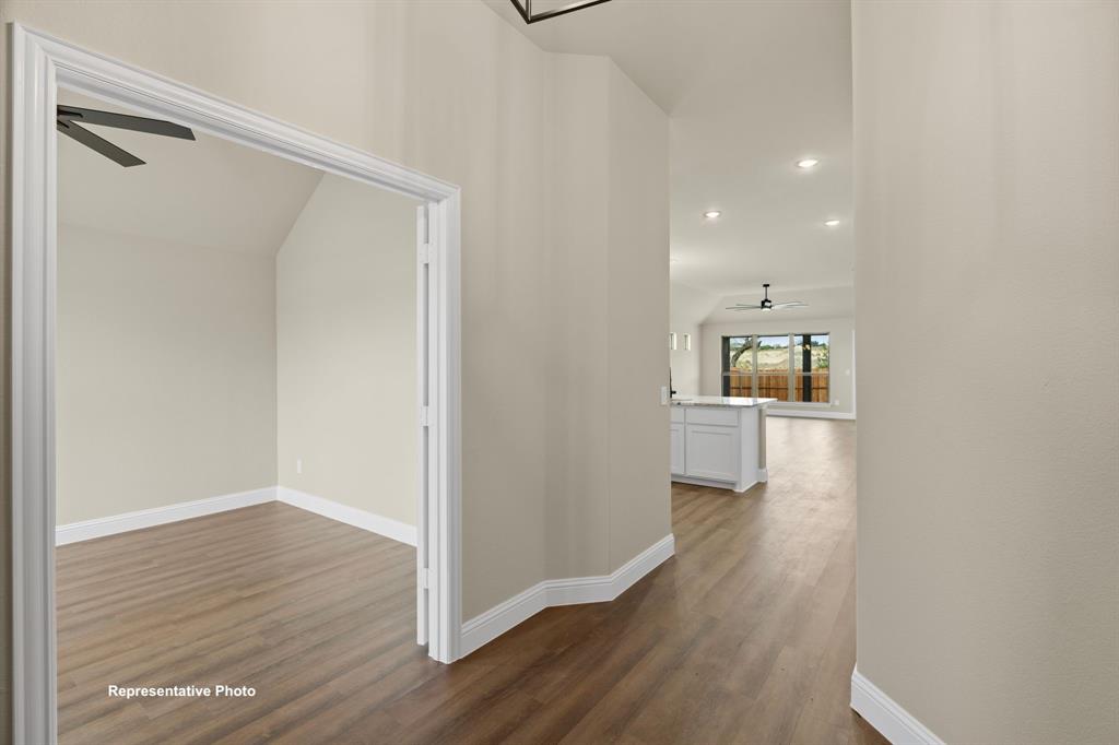 448 Mcalpine Springtown, TX 76082 - Photo 2 of 9 a view of a hallway with wooden floor