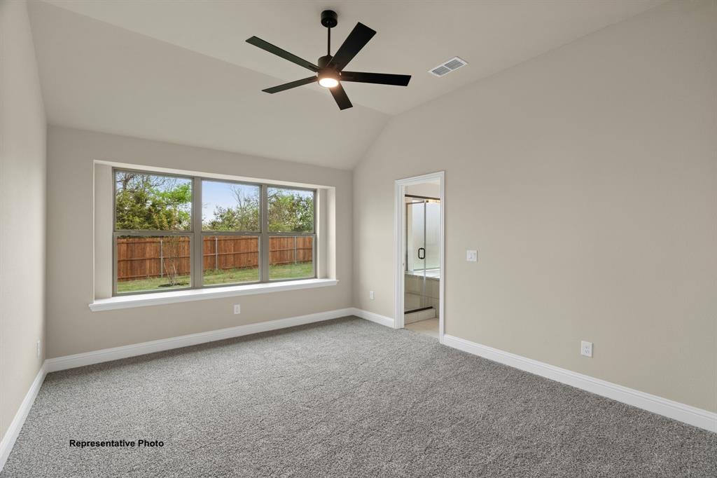 448 Mcalpine Springtown, TX 76082 - Photo 7 of 9 a view of a livingroom with a ceiling fan and window