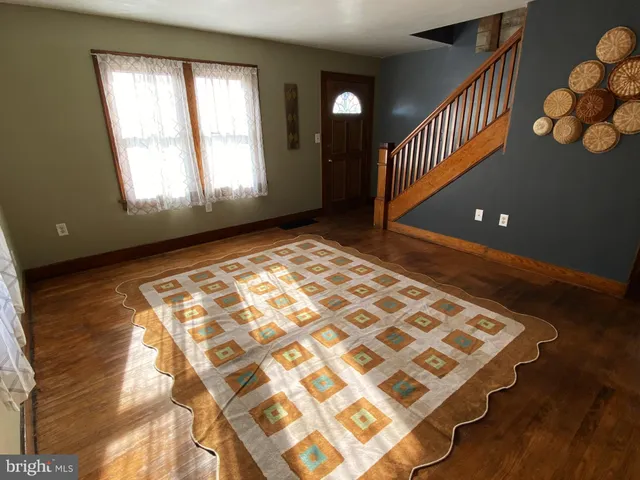 a view of an empty room and wooden floor