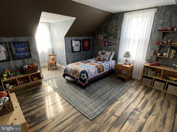 a bed room with a bed and a window