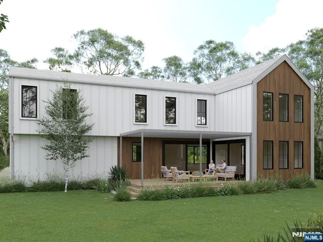 a front view of a house with a yard and porch