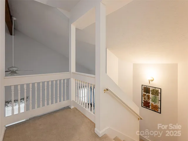 a view of a hallway with staircase