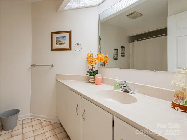 a bathroom with a sink toilet and mirror