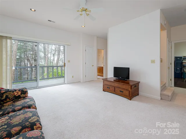 a bed room with a bed and a television