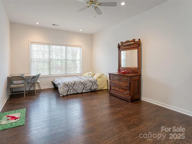 a bedroom with furniture and a window