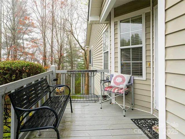a view of a balcony with chairs