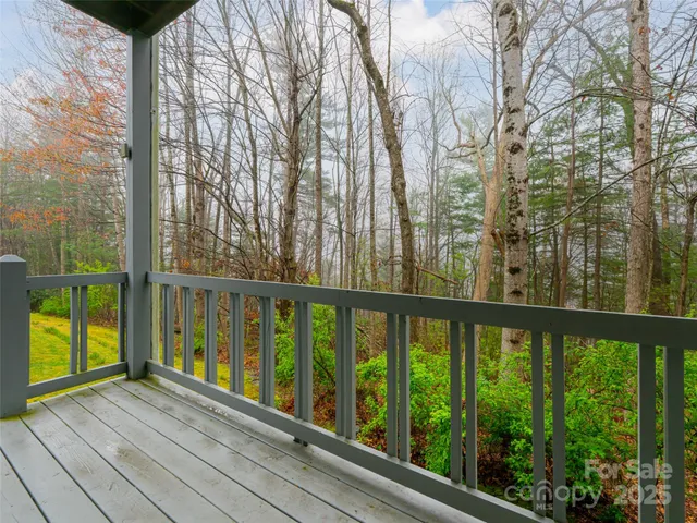 a view of a balcony with wooden floor