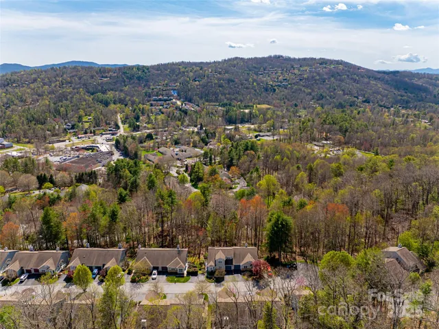 an aerial view of residential house and sandy dunes