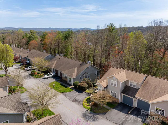 an aerial view of a house with a garden