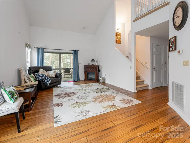 a view of a livingroom with furniture and hardwood floor