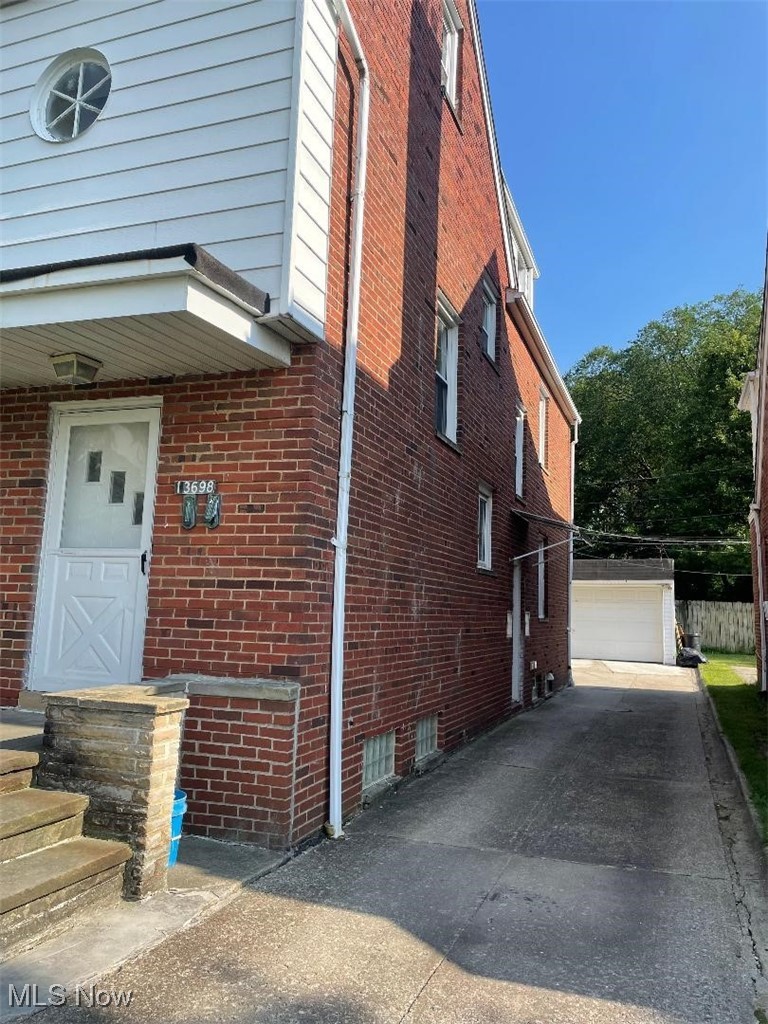 13698 Cedar Road Cleveland, OH 44118 - Photo 2 of 33 View of side of home featuring brick siding
