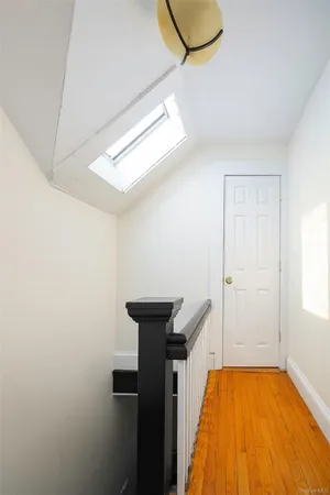 a view of a room with wooden floor and balcony