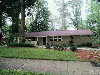 1061 Shelley Road Raleigh, NC 27609 - Photo 1 of 1 a front view of a house with a garden