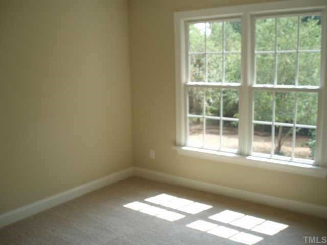 661 Shelley Road Raleigh, NC 27609 - Photo 8 of 8 an empty room with a window