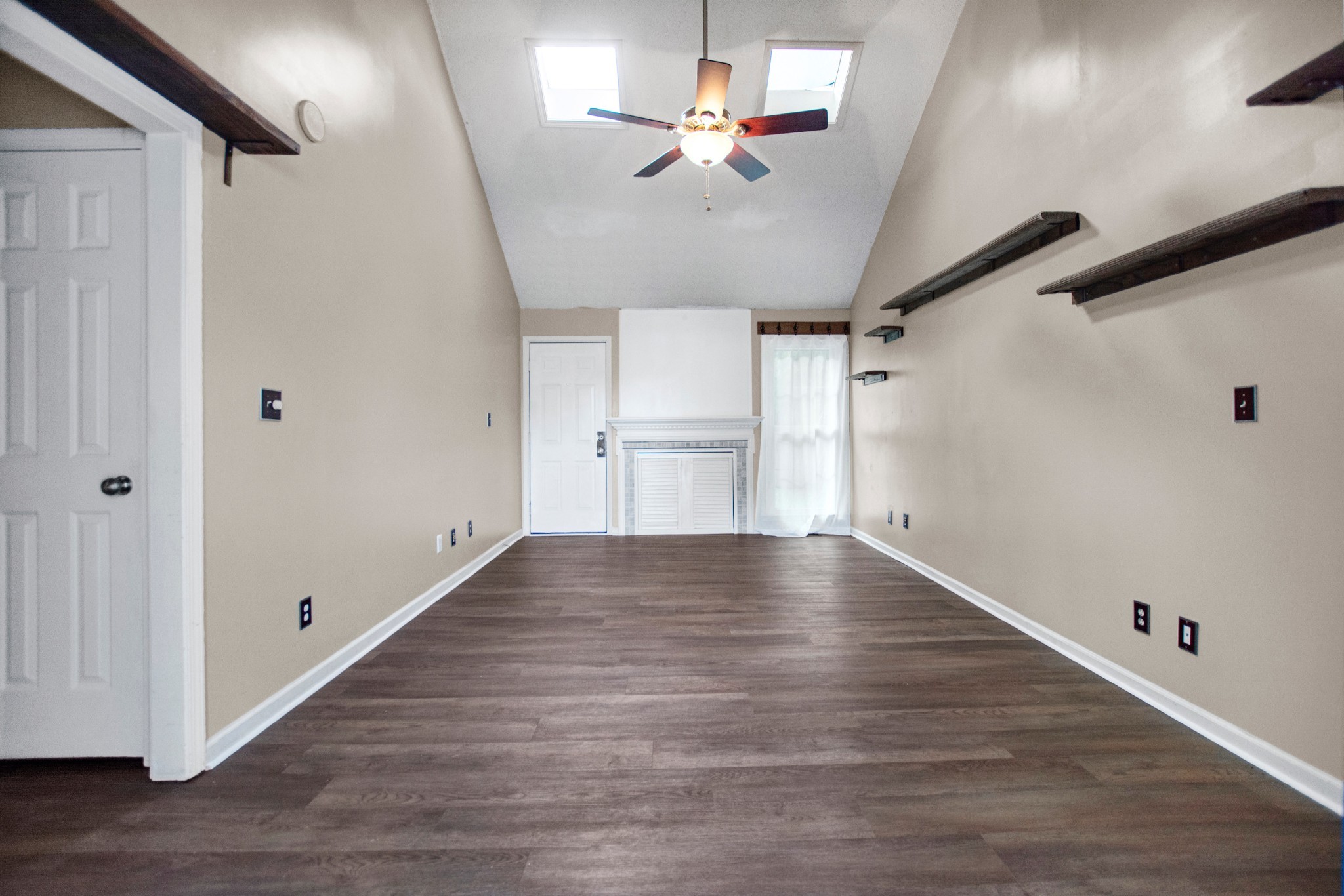 128 South Richview Road Clarksville, TN 37043 - Photo 7 of 19 a view of an empty room with a window and wooden floor