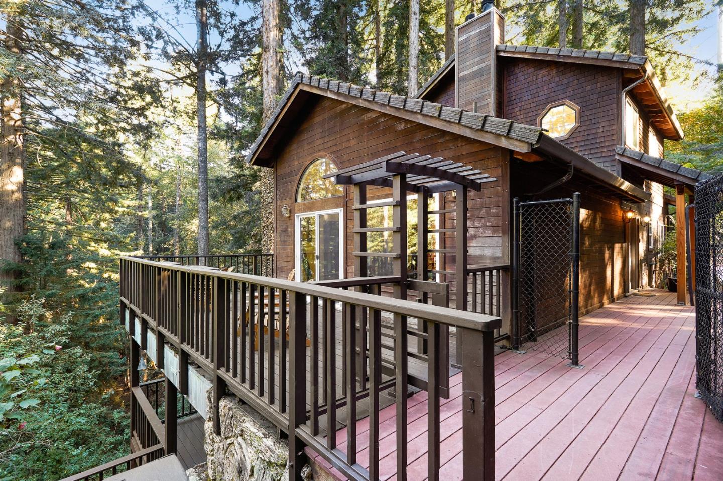 a view of a wooden house with a small yard
