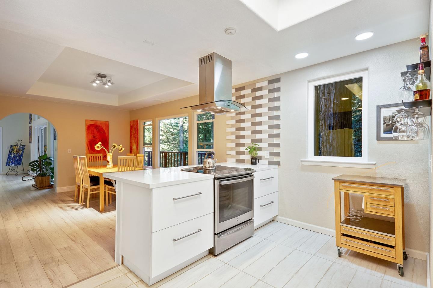 170 Swett Road Woodside, CA 94062 - Photo 11 of 36 a kitchen that has a stove and white cabinets