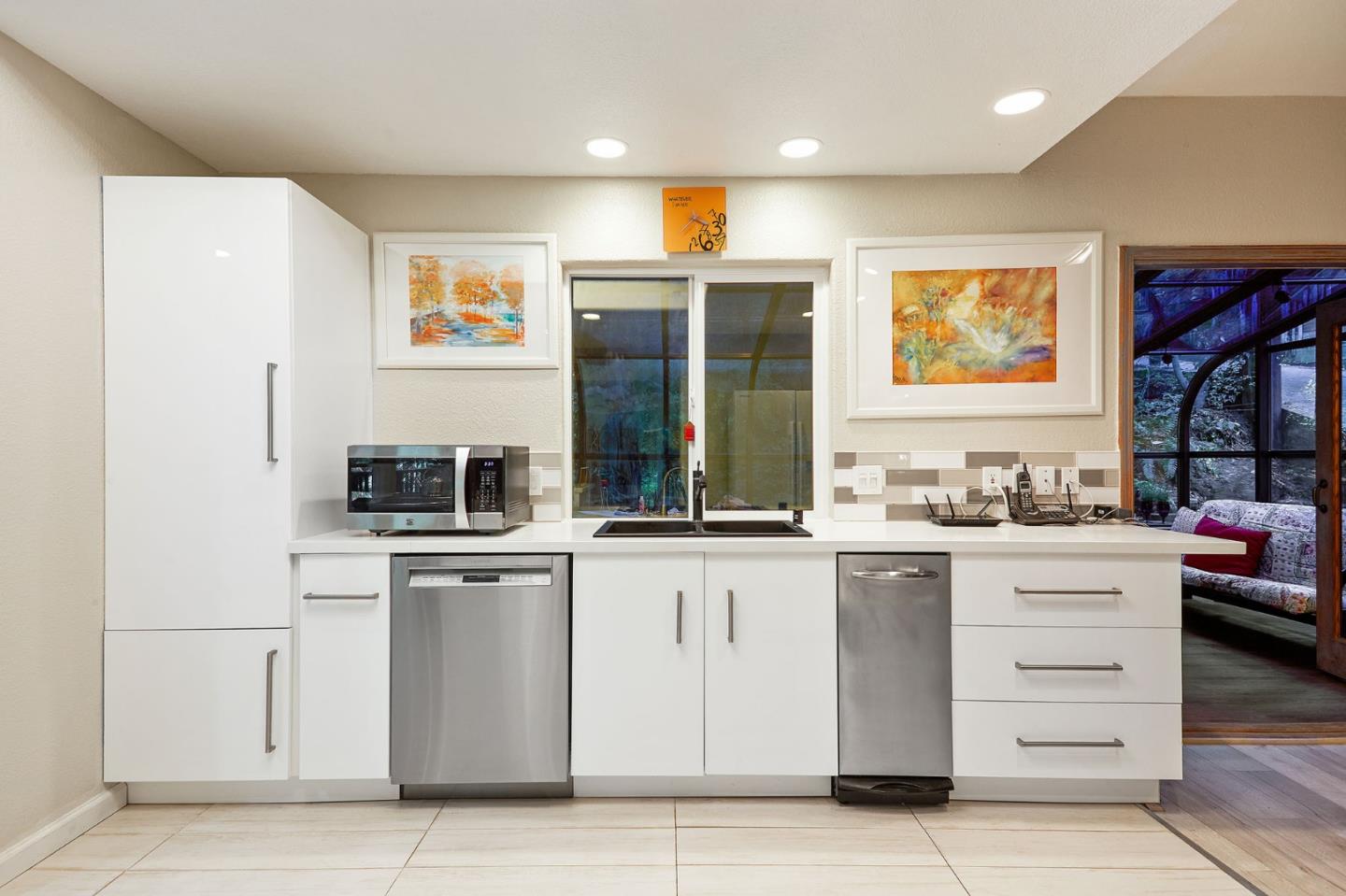 170 Swett Road Woodside, CA 94062 - Photo 12 of 36 a kitchen with stainless steel appliances granite countertop a stove and a sink