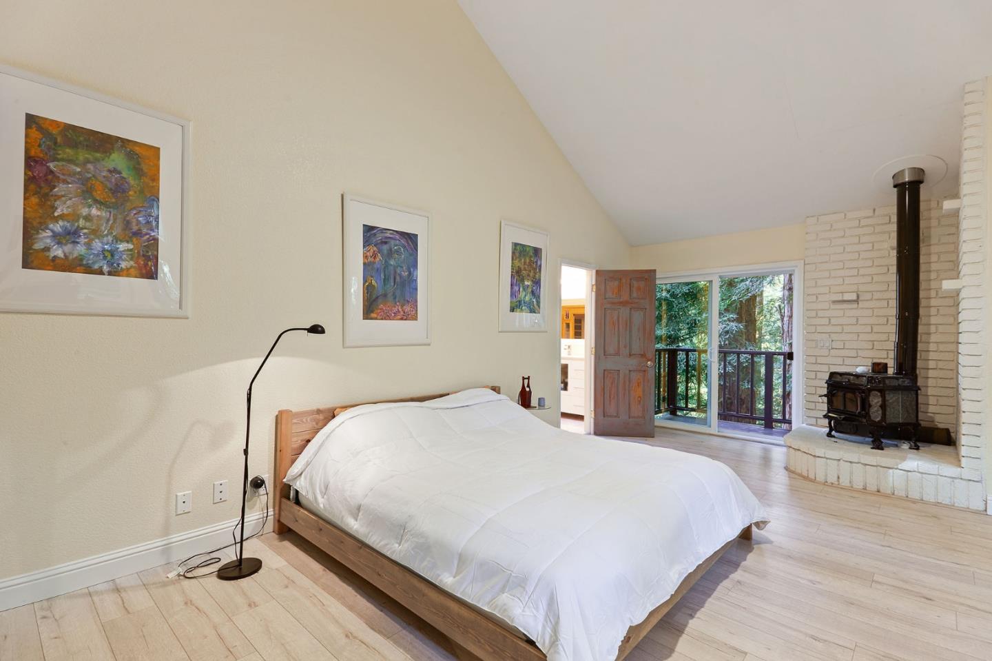 170 Swett Road Woodside, CA 94062 - Photo 16 of 36 a large bed sitting in a spacious bedroom next to a window