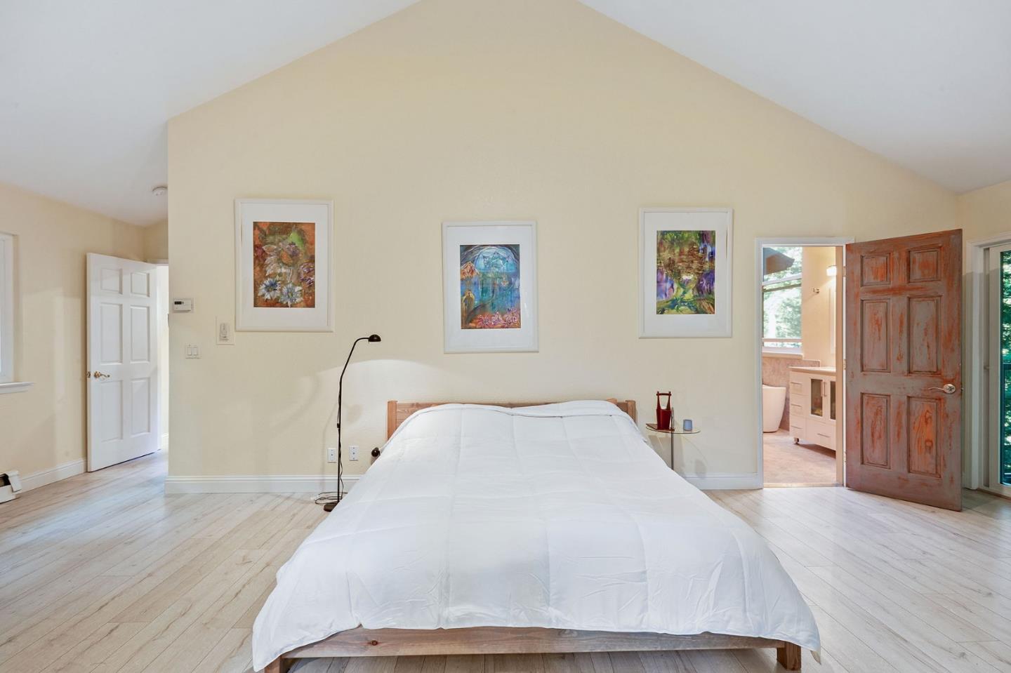 170 Swett Road Woodside, CA 94062 - Photo 17 of 36 a bedroom with a bed and wooden floor