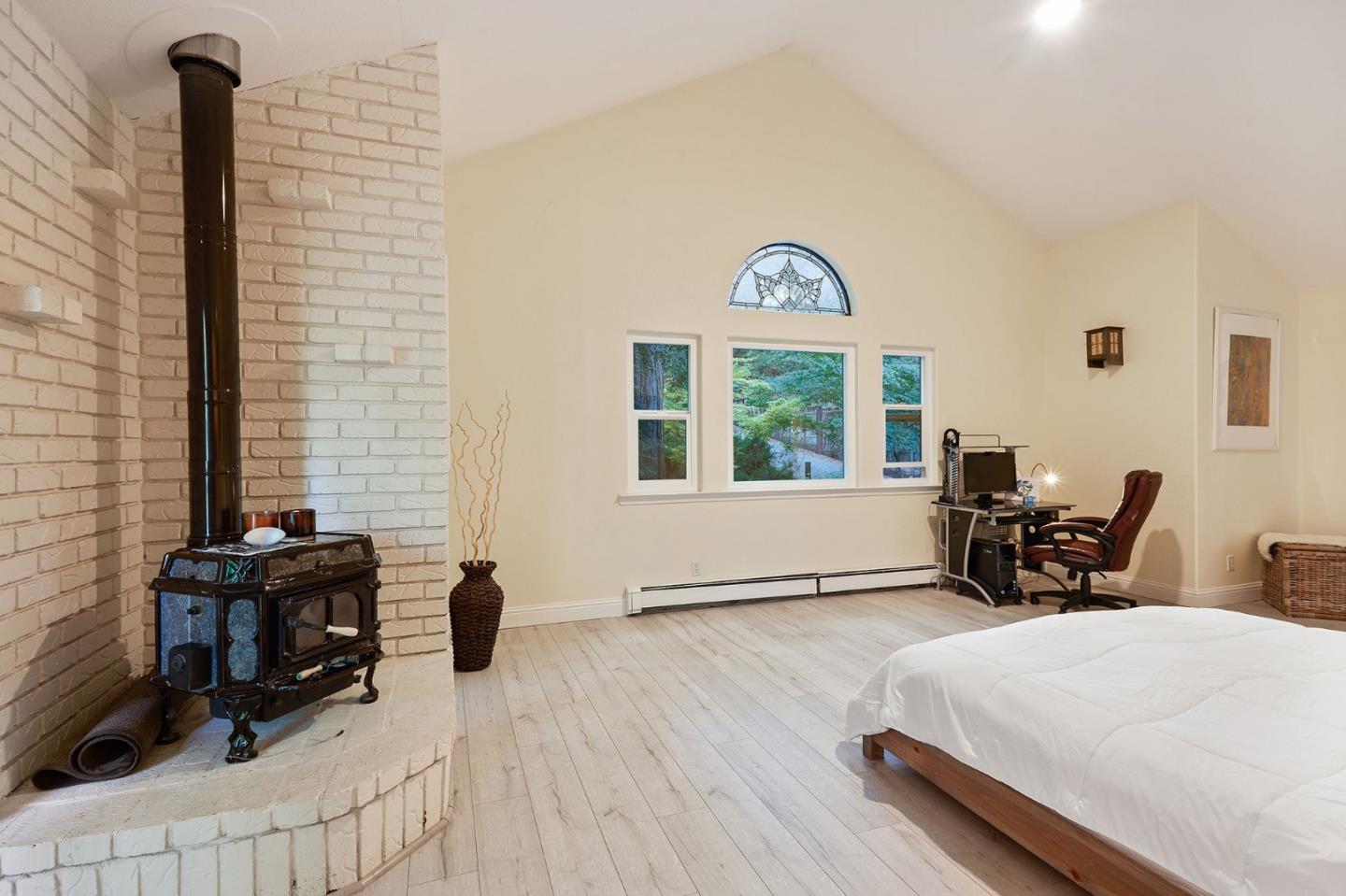 170 Swett Road Woodside, CA 94062 - Photo 18 of 36 a bedroom with furniture and a window
