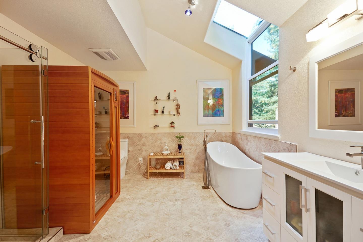 170 Swett Road Woodside, CA 94062 - Photo 19 of 36 a bathroom with a tub sink and mirror