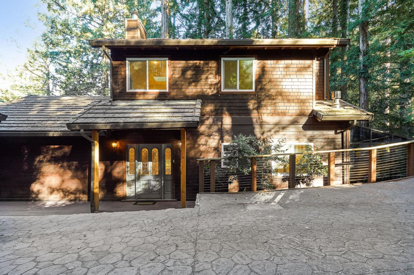 170 Swett Road Woodside, CA 94062 - Photo 2 of 36 a view of a house with large windows
