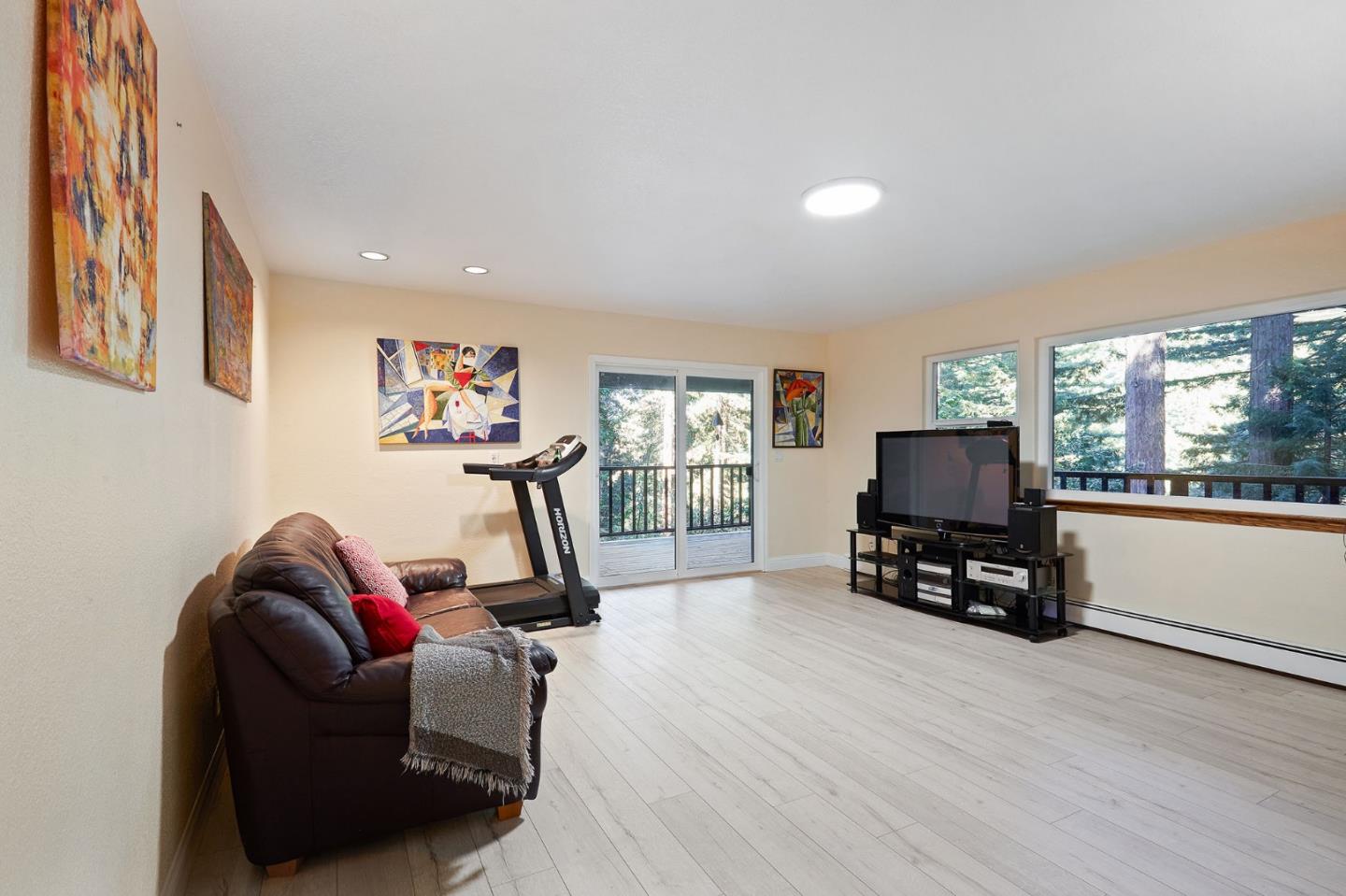 170 Swett Road Woodside, CA 94062 - Photo 24 of 36 a living room with furniture a window and a flat screen tv