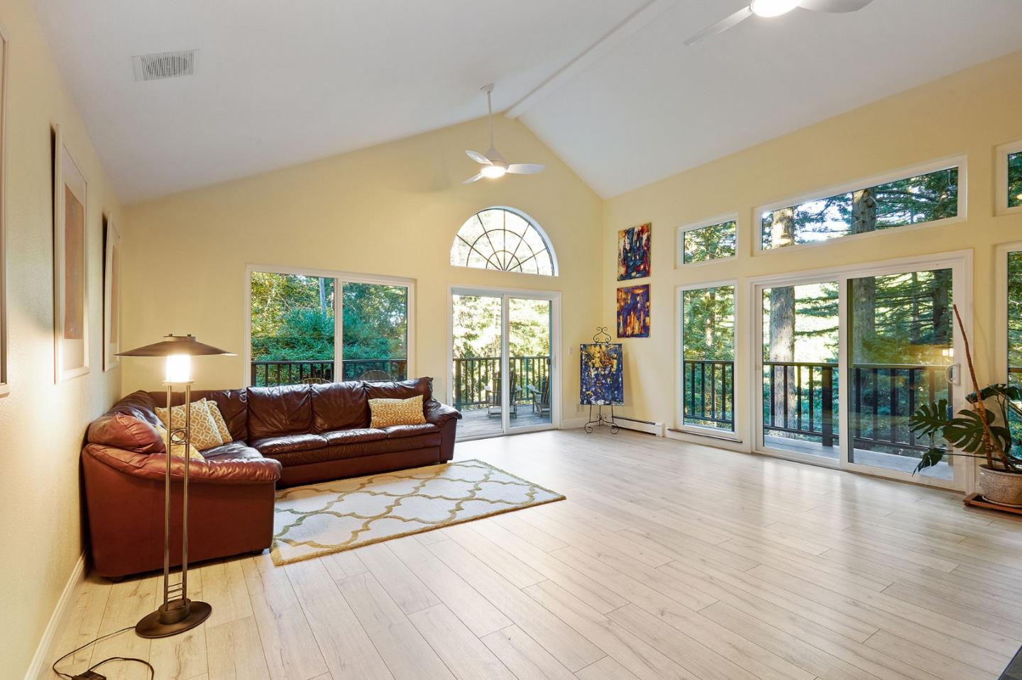 170 Swett Road Woodside, CA 94062 - Photo 4 of 36 a living room with furniture fireplace and large windows