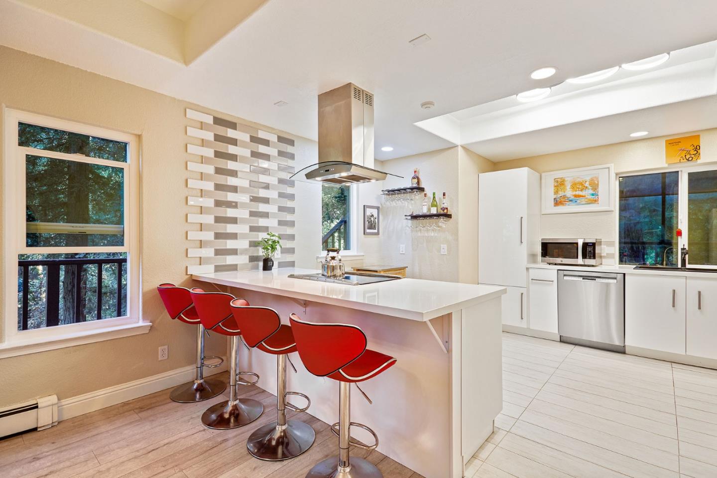 170 Swett Road Woodside, CA 94062 - Photo 9 of 36 a kitchen with stainless steel appliances kitchen island granite countertop a sink and cabinets