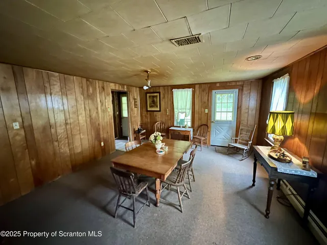 a room with furniture and a flat screen tv