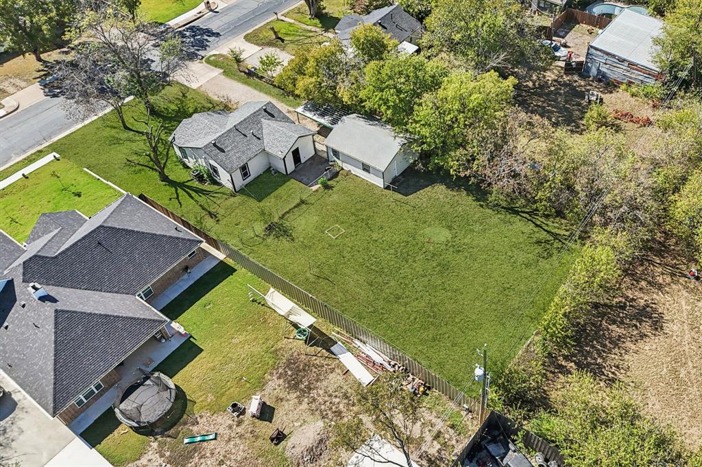 5621 Bonnie Drive Watauga, TX 76148 - Photo 24 of 40 an aerial view of a house with a garden and swimming pool