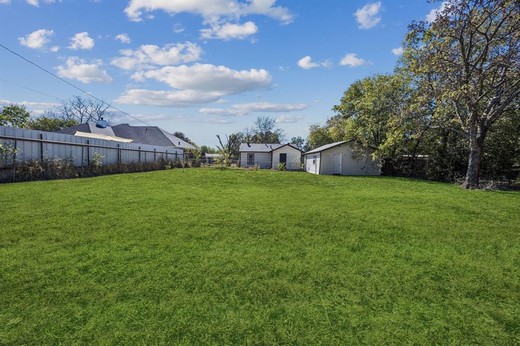 5621 Bonnie Drive Watauga, TX 76148 - Photo 32 of 40 a view of a yard with a house in the background