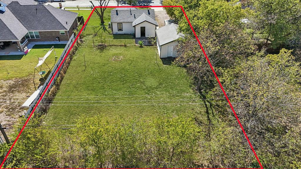 5621 Bonnie Drive Watauga, TX 76148 - Photo 36 of 40 a backyard of a house with lots of green space and fountain